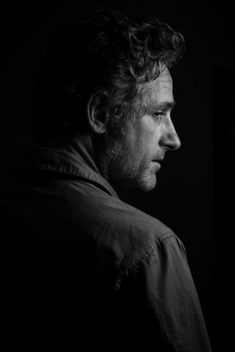 Tom Stade in profile, black and white portrait