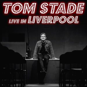 Tom Stade is sat on stage in Liverpool.